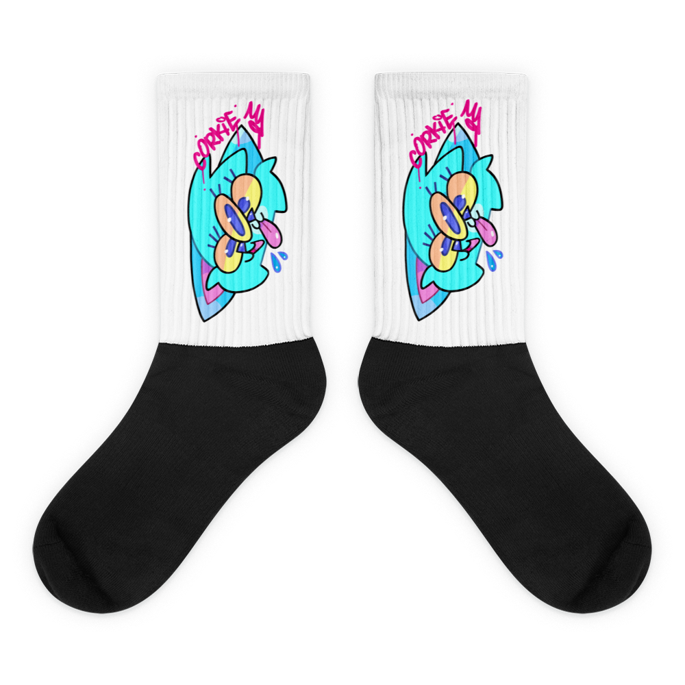 street wear socks with a cartoon graffiti character printed onto them. the character is a blue cat with three eyes, designed by Brighton street artist CORKiE