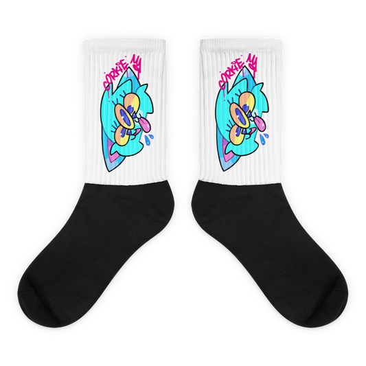 street wear socks with a cartoon graffiti character printed onto them. the character is a blue cat with three eyes, designed by Brighton street artist CORKiE