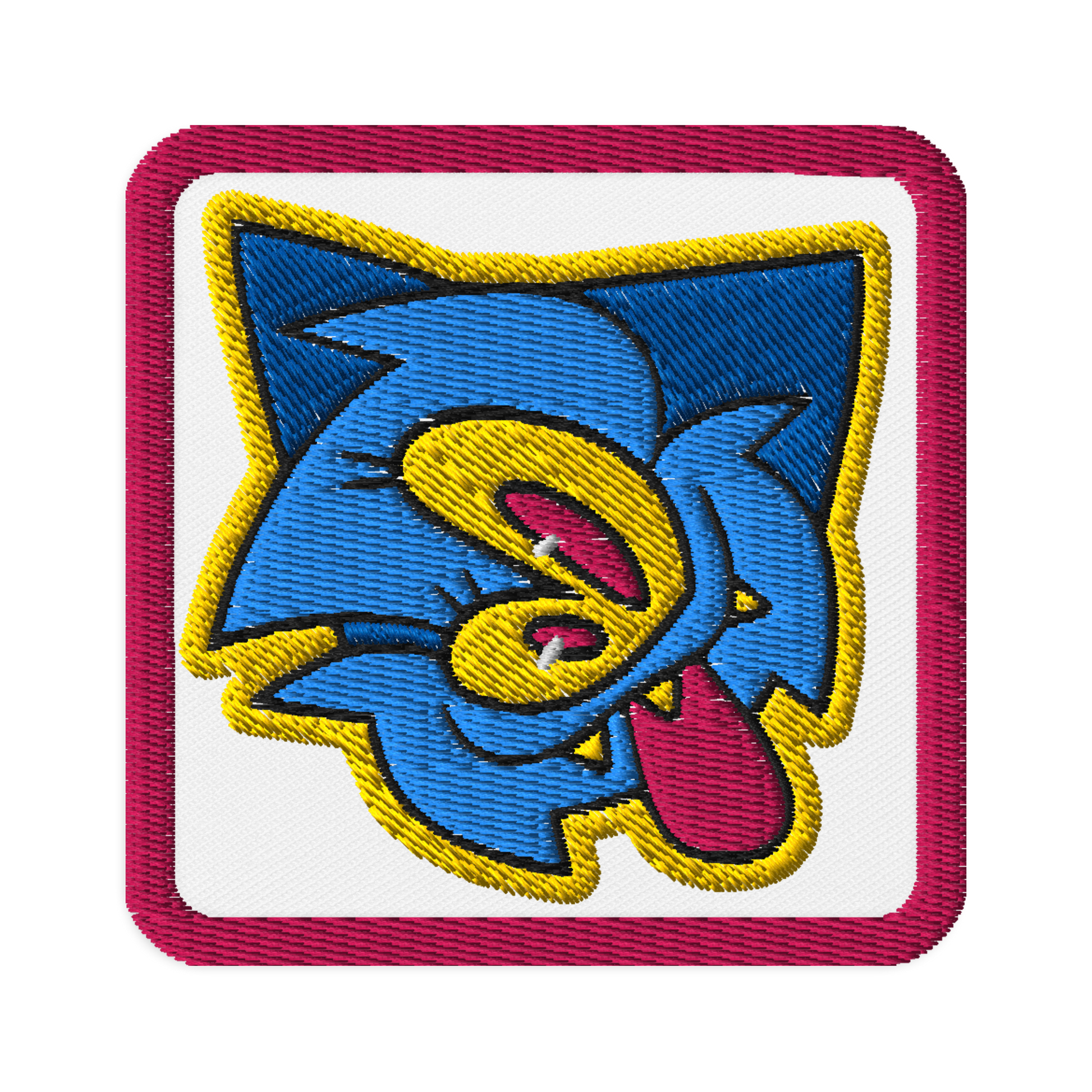 embroidered patch of a blue furry monster character by Brighton street artist CORKiE