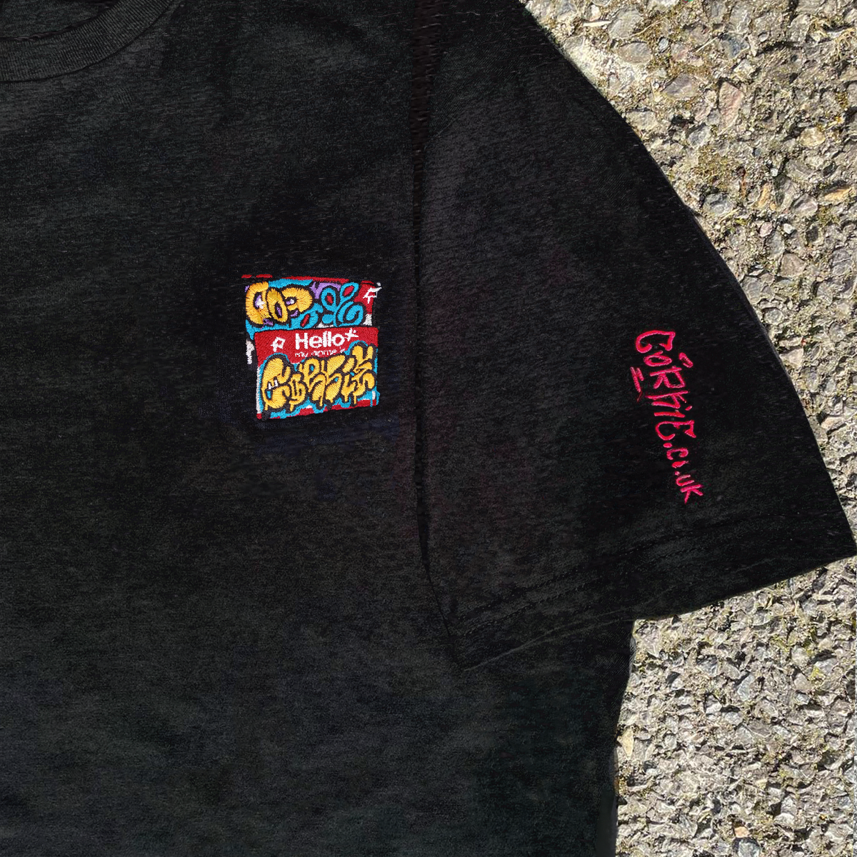 'Hello my name is' graffiti sticker embroidery pattern, on a shirt by indie streetwear brand CORKiE, based in Brighton.