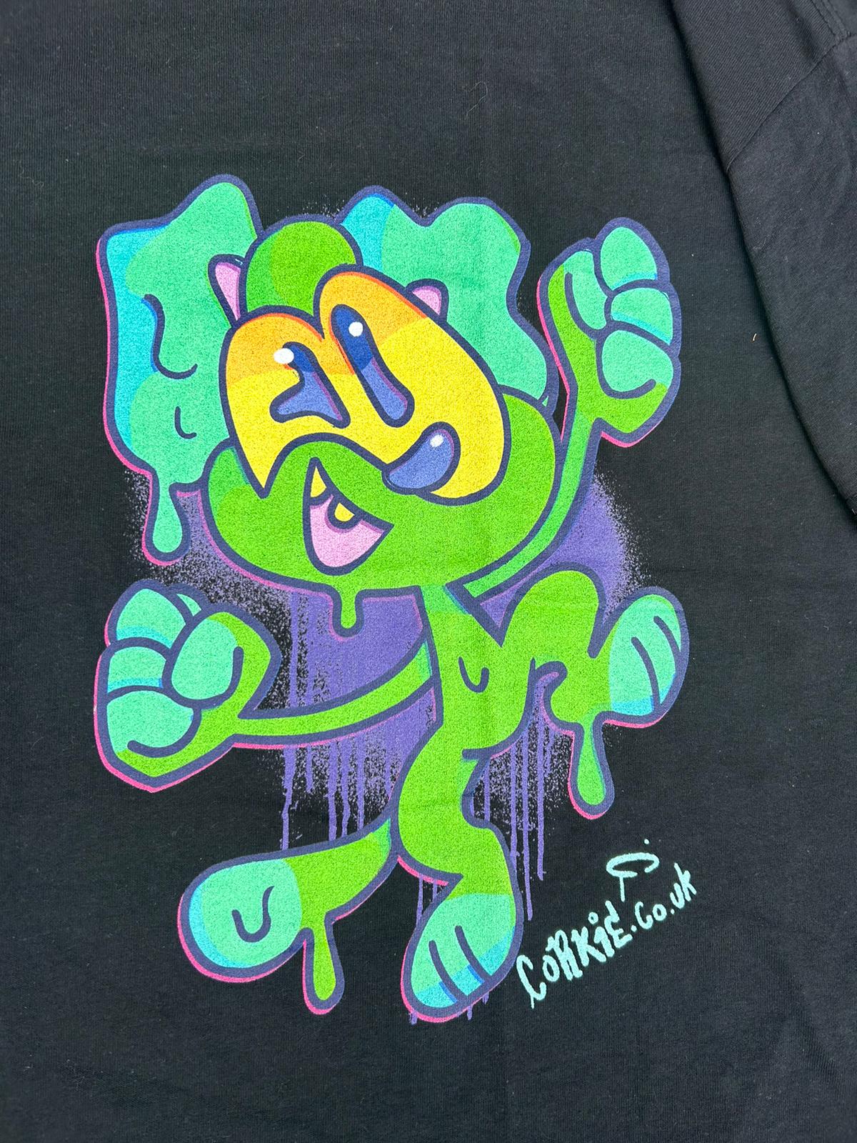 Green monster character on a black streetwear t-shirt, in a graffiti art style, by brand CORKiE