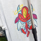 devil CORKiE character Diablo as an angel. On a shirt by CORKiE, an indie streetwear brand based off of graffiti artwork.