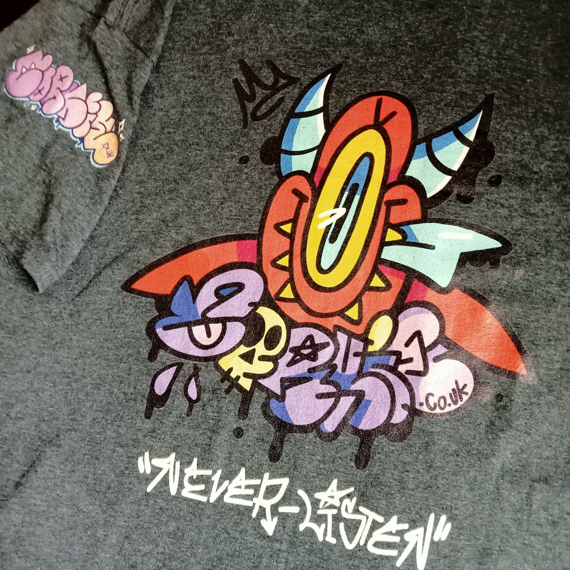street wear devil shirt, grey featuring hand style 'never listen' graffiti tag underneath graff devil character and a CORKiE throwie
