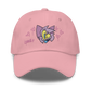 a pink indie street wear cap with a furry character embroidered on the front