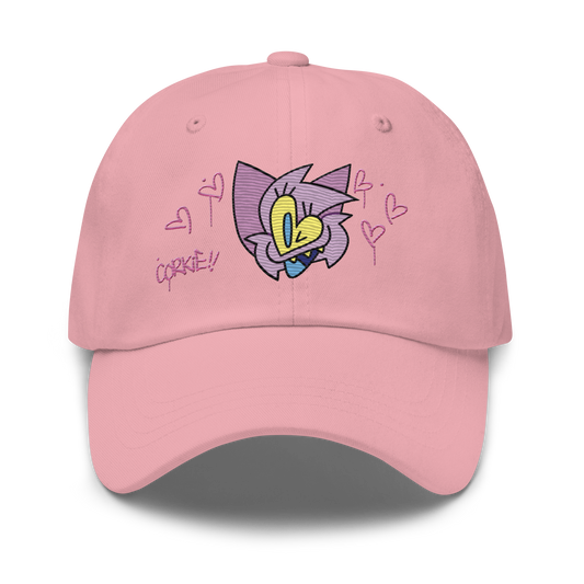 a pink indie street wear cap with a furry character embroidered on the front