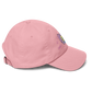 a pink indie street wear cap with a furry character embroidered on the front
